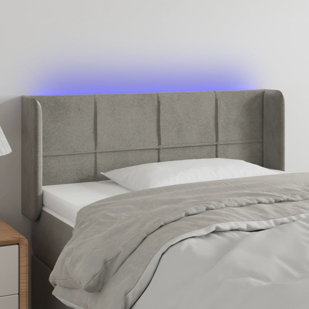 sengegavl med LED-lys 83x16x118/128 cm fløjl lysegrå
